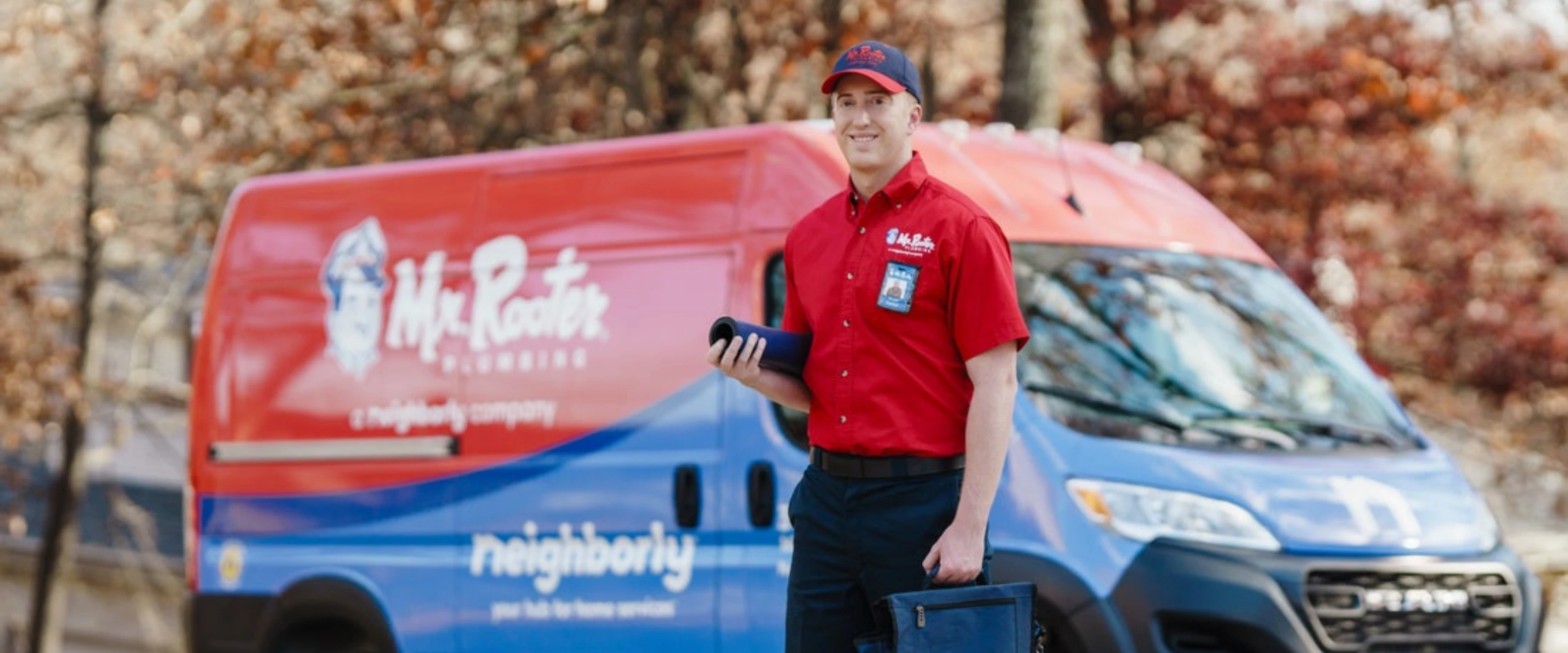 Male technician speaking with woman.